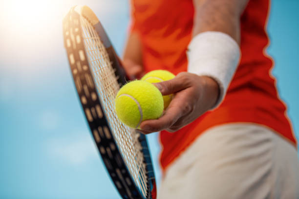 istock Man on tennis court 1174616537