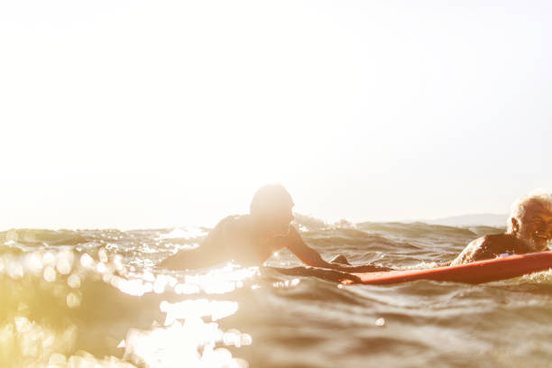 istock Friends surfing in senior years 1174618828
