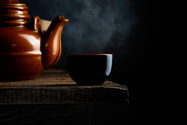 Asian food background - tea on dark rustic background. Dark background.