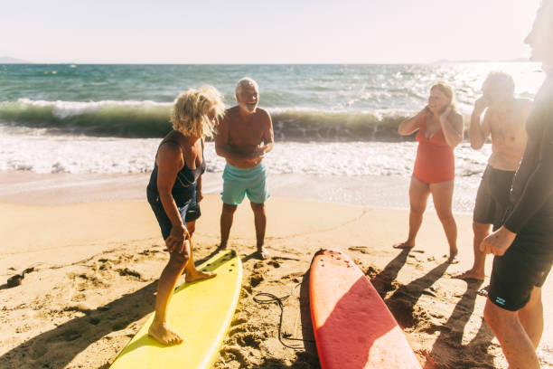 istock Surfing lessons for seniors 1174619088