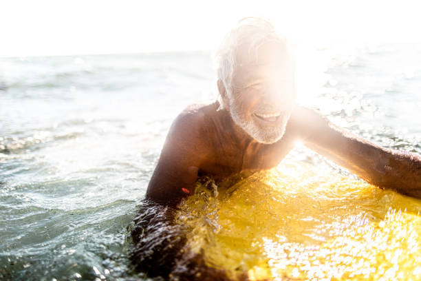 istock Portrait of a senior surfer 1174619190