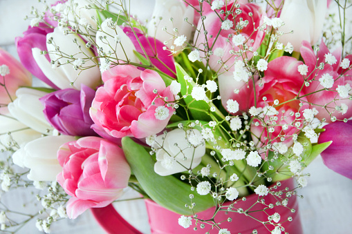 Pink flower bouquet with vase isolated on white background