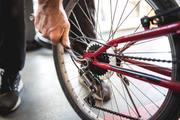 istock Fixing the bicycle problem in workshop stock photo 1174625592