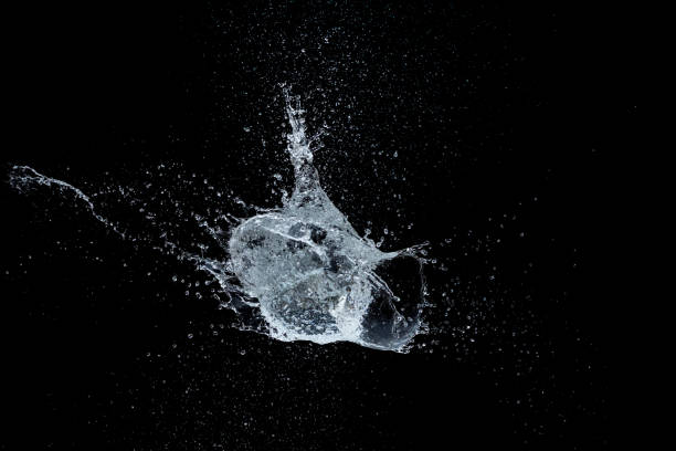 istock Water Ball on Black Background 1174630023