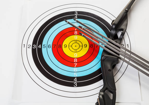 istock Bow and arrows with bulls eye target 1174630054