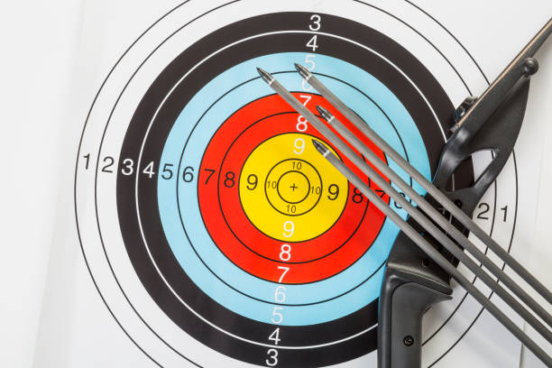 istock Bow and arrows with bulls eye target 1174630056