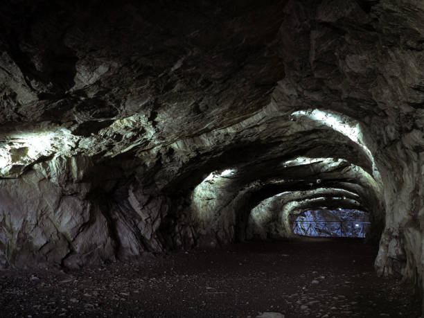 istock Adit in abandoned marble quarry. Mine in the mountains 1174632808
