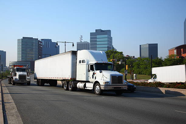 trucks on a city highway stock photo