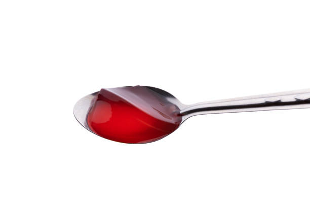 istock strawberry Jelly with spoon on isolated white background 1174634224