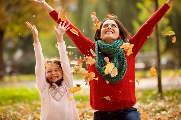 istock Mother and daughter having fun in the park 1174634336