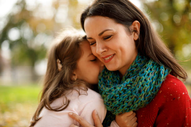 istock Mother and daughter playing in the park 1174634407