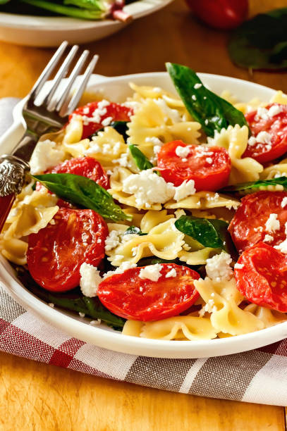 Tomato, Spinach, and Cheese Pasta Recipe - Image stock photo