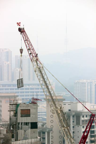 This picture has taken in September 2019 in Jurong East, Singapore. This picture presets a typical contruction site of a tall building in Singapore. Due to the air pollution in Singapore due to the bush fire in Indonesia, bulidings further away faded away.