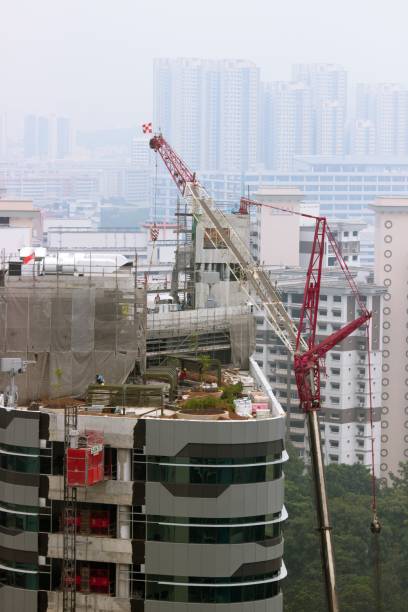 This picture has taken in September 2019 in Jurong East, Singapore. This picture presets a typical contruction site of a tall building in Singapore. Due to the air pollution in Singapore due to the bush fire in Indonesia, bulidings further away faded away.