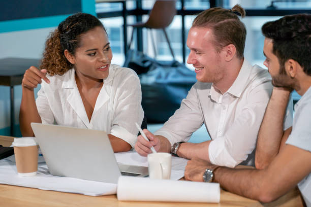 istock Group of young business people discussing in modern coworking space. Teamwork Cooperation . meeting .  communicating together. Working in the Office .Partnership . multiracial entrepreneurs 1174638621