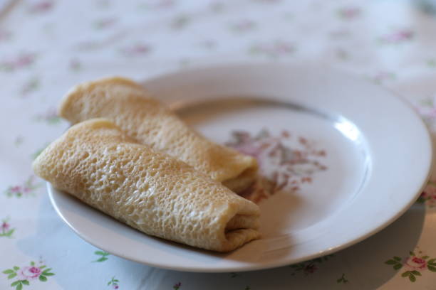 istock Pancakes rolled into a roll  lie on a plate 1174638959