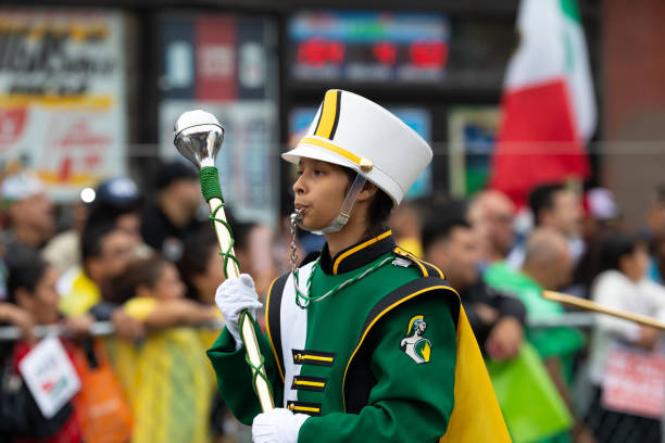 Chicago, Illinois, USA - September 8, 2019: 26th Street Mexican Independence Parade Members of The Trojan Band from Kelly High School, performing at the parade