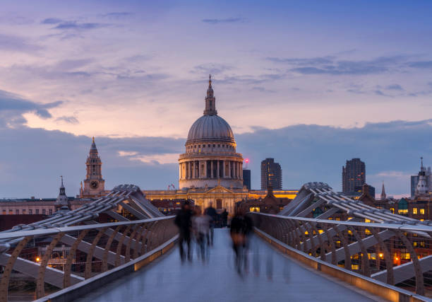istock Millennium Bridge and St. Paul's cathedral with commuters at dusk 1174640307
