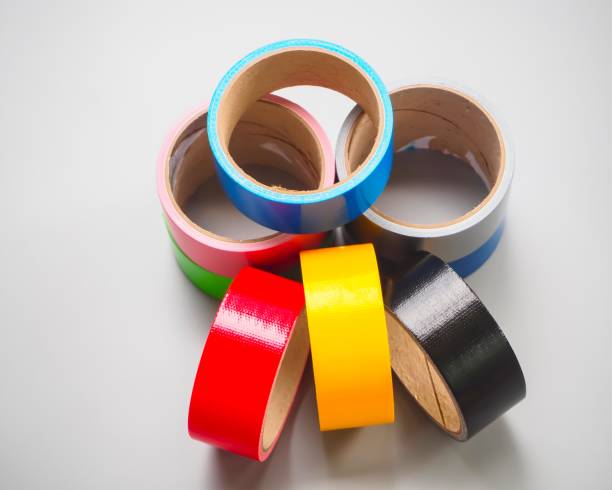 istock Rolls sticky tapes isolated on white background. colorful tapes top view 1174643954