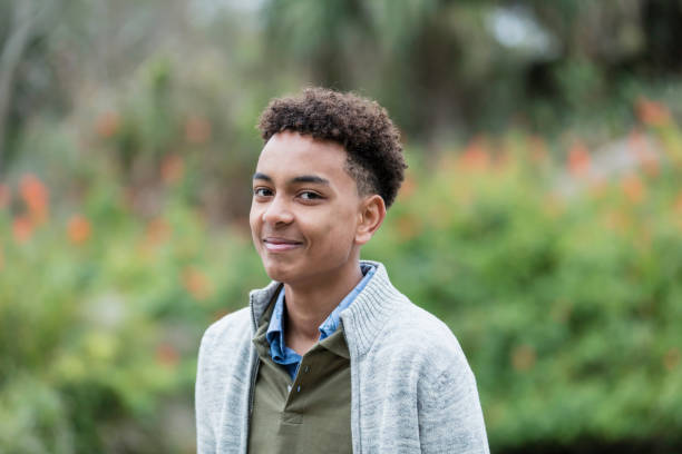 istock Confident mixed race boy at a park 1174645602