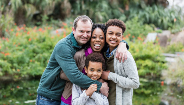 istock Interracial family with two boys in park 1174646803