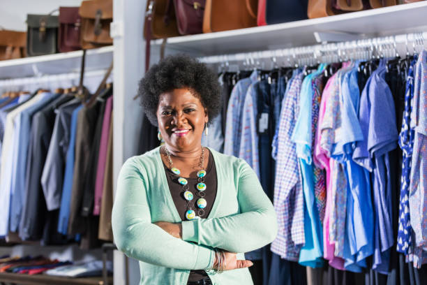 istock Woman working in men's clothing store 1174647724