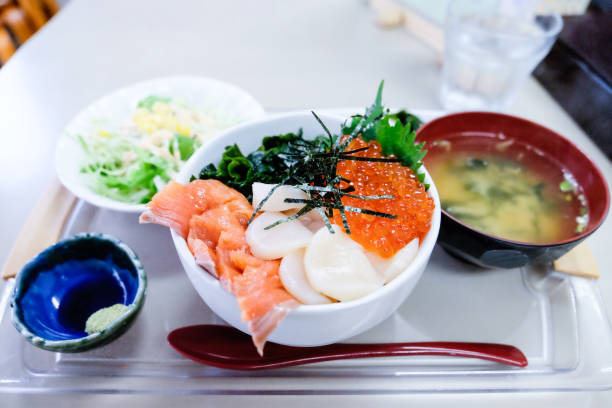 istock Sashimi set rice, Mixed Sashimi don, Raw salmon fish ,shell ,salmon eggs,seaweed,the set put on tray with Miso soup,wasabi,vegetable,and spoon,Japanese food called Kaisen Don or Ikura Don in Japan. 1174647785