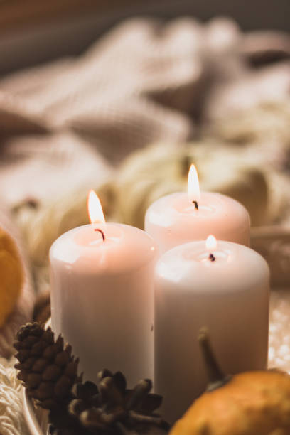 istock autumn cosy candles, pumpkin, and blanket 1174649925