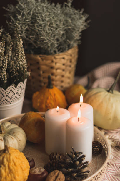 istock autumn cosy candles, pumpkin, and blanket 1174649973