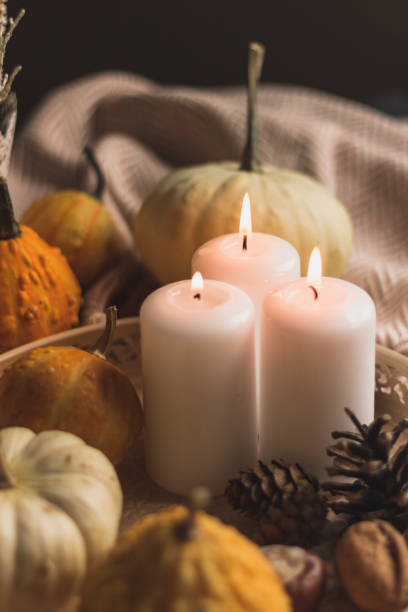 istock autumn cosy candles, pumpkin, and blanket 1174649983
