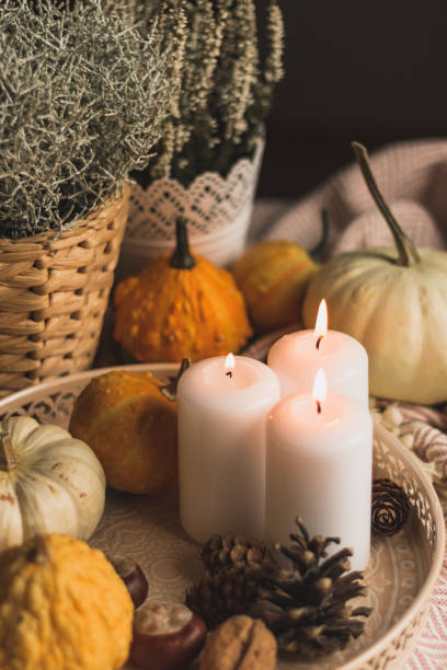 istock autumn cosy candles, pumpkin, and blanket 1174649992