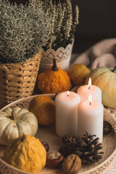 istock autumn cosy candles, pumpkin, and blanket 1174649999