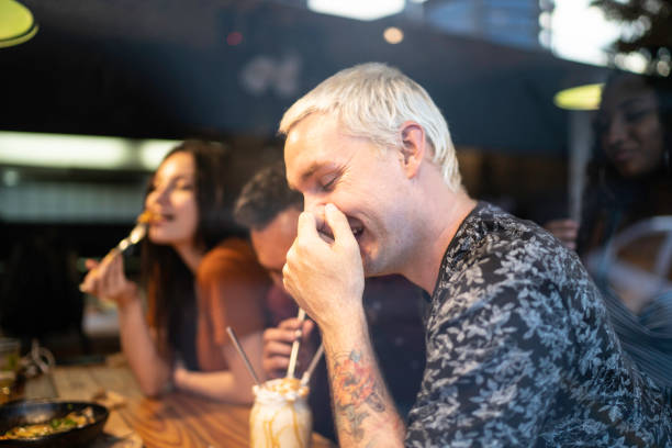 istock Group of friends sharing a milkshake 1174650275
