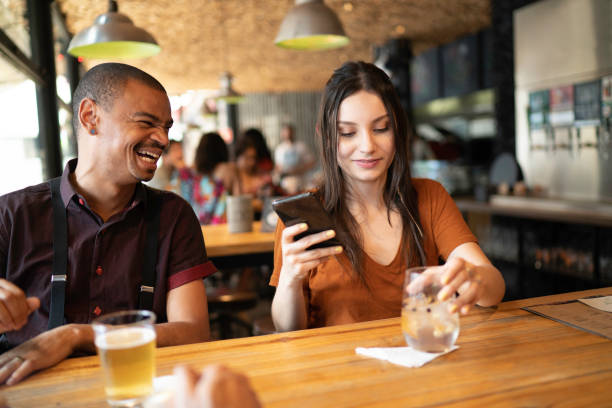 istock Friends having fun seeing something in smartphone 1174650334