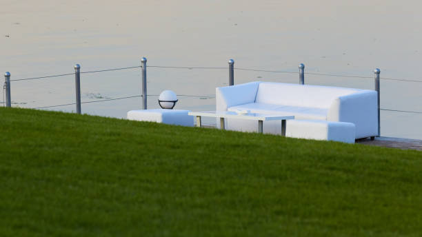 istock Lounge area for guests outside. White sofas and tables 1174651115