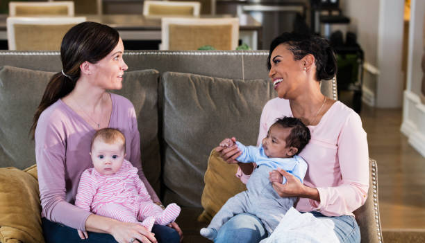 istock Two new mothers and their babies 1174651610