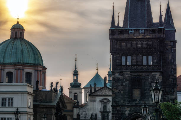 old town bridge tower spires spires of various prague towers and roof tops taken during sunrise hours from the charles bridge. old town bridge tower stock pictures, royalty-free photos & images