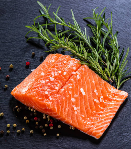 istock Fresh raw salmon steak on stone plate 1174655231