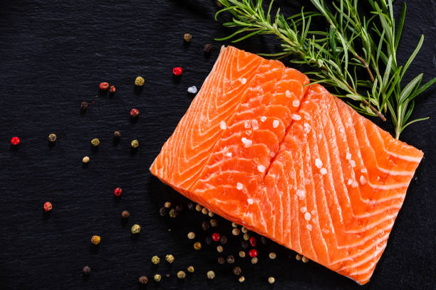 istock Fresh raw salmon steak on stone plate 1174655300
