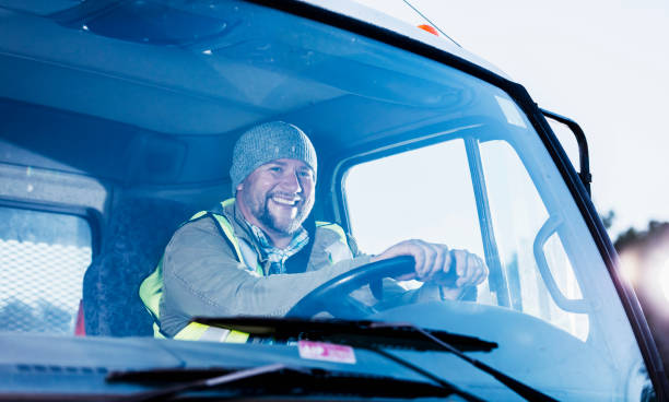 istock Hispanic man driving a truck 1174655580
