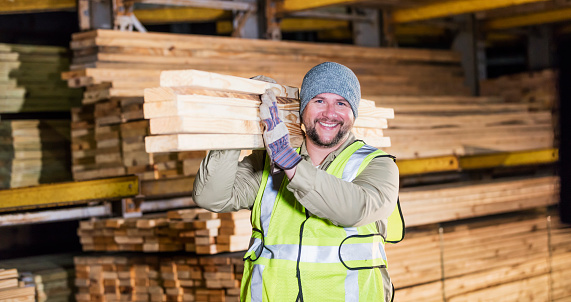 Hispanic man working at lumber yard