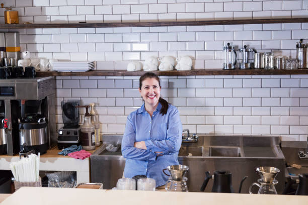 istock Hispanic woman working in coffee shop 1174657559