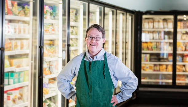 Man with down syndrome working in supermarket