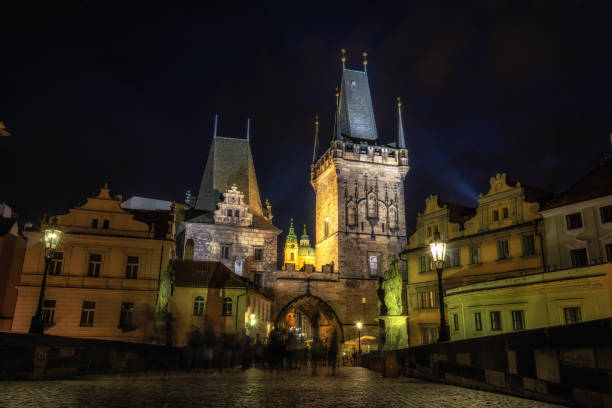 istock lesser town bridge tower at night 1174658306