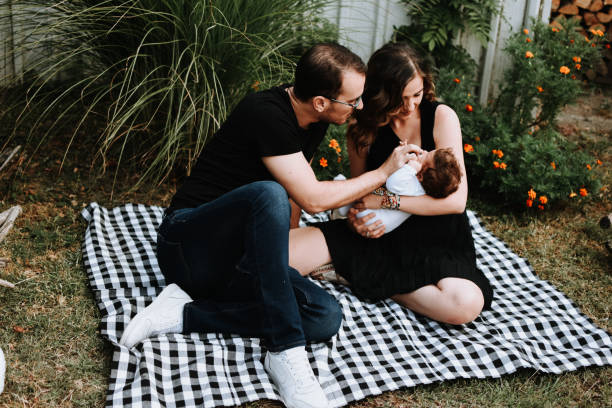 istock Happy young father and motherwith cute baby 1174658621