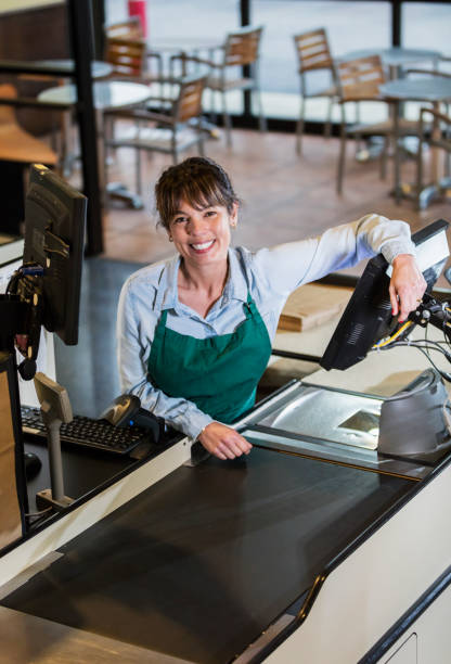 istock Woman working as supermarket cashier 1174658708