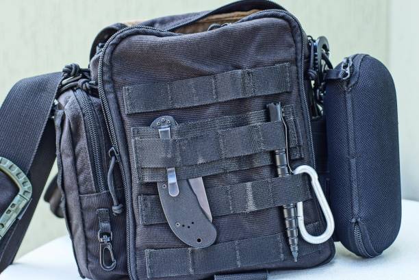 istock one black backpack with a set of items and tools 1174660817