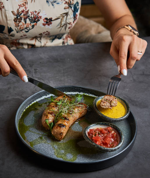 istock close - up of hands with a fork over a plate 1174663265