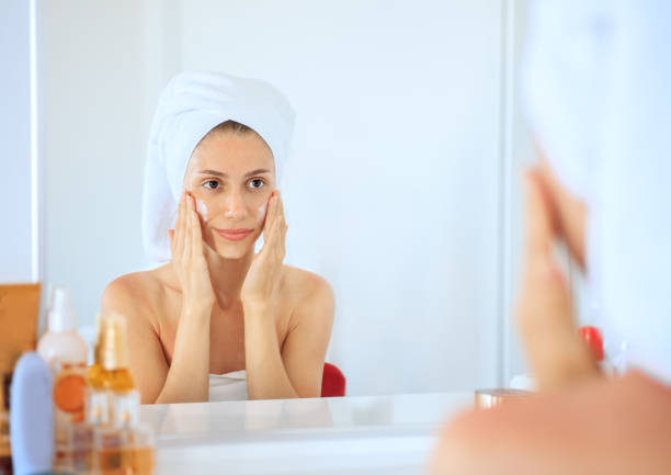 istock Woman doing face care 1174675642