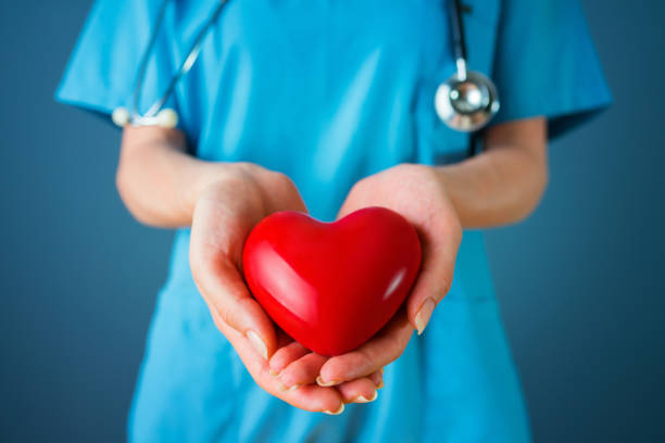 istock Doctor holding heart 1174677444